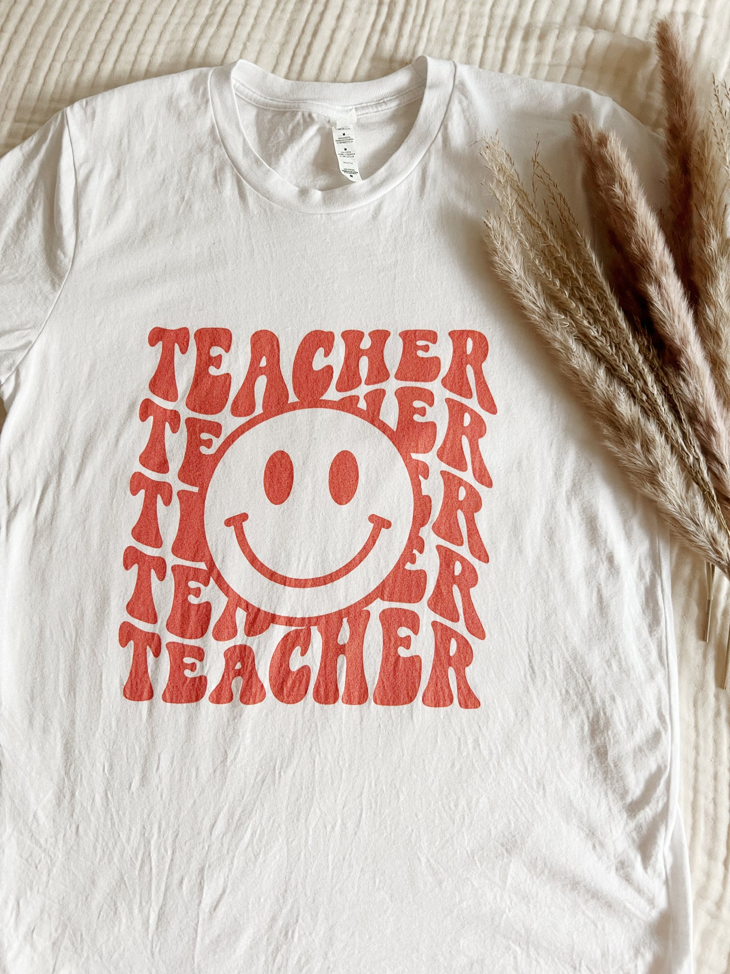 Wavy Teacher Smiley Tee